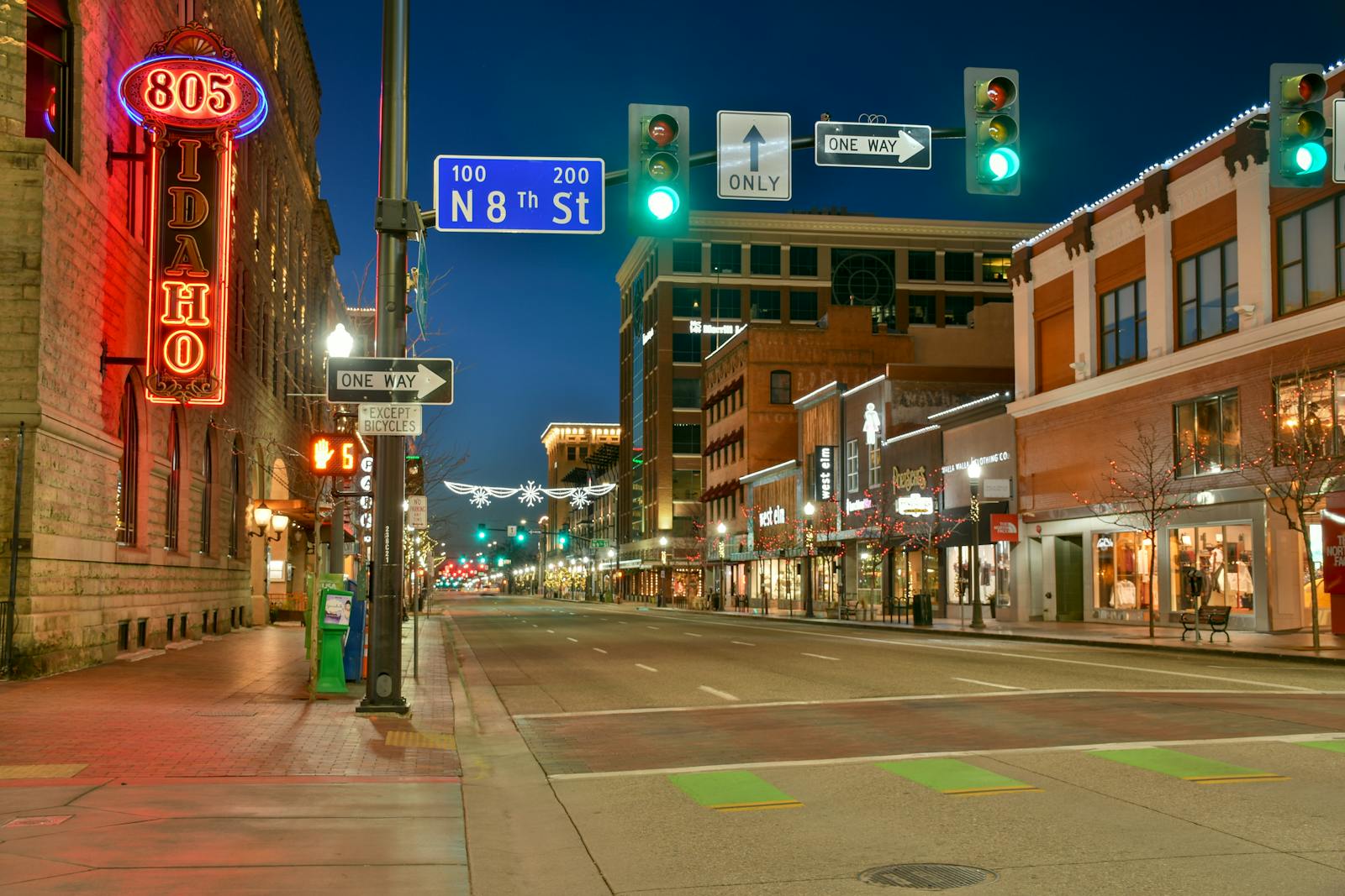 Downtown Omaha street at dusk with warm lights during Berkshire weekend